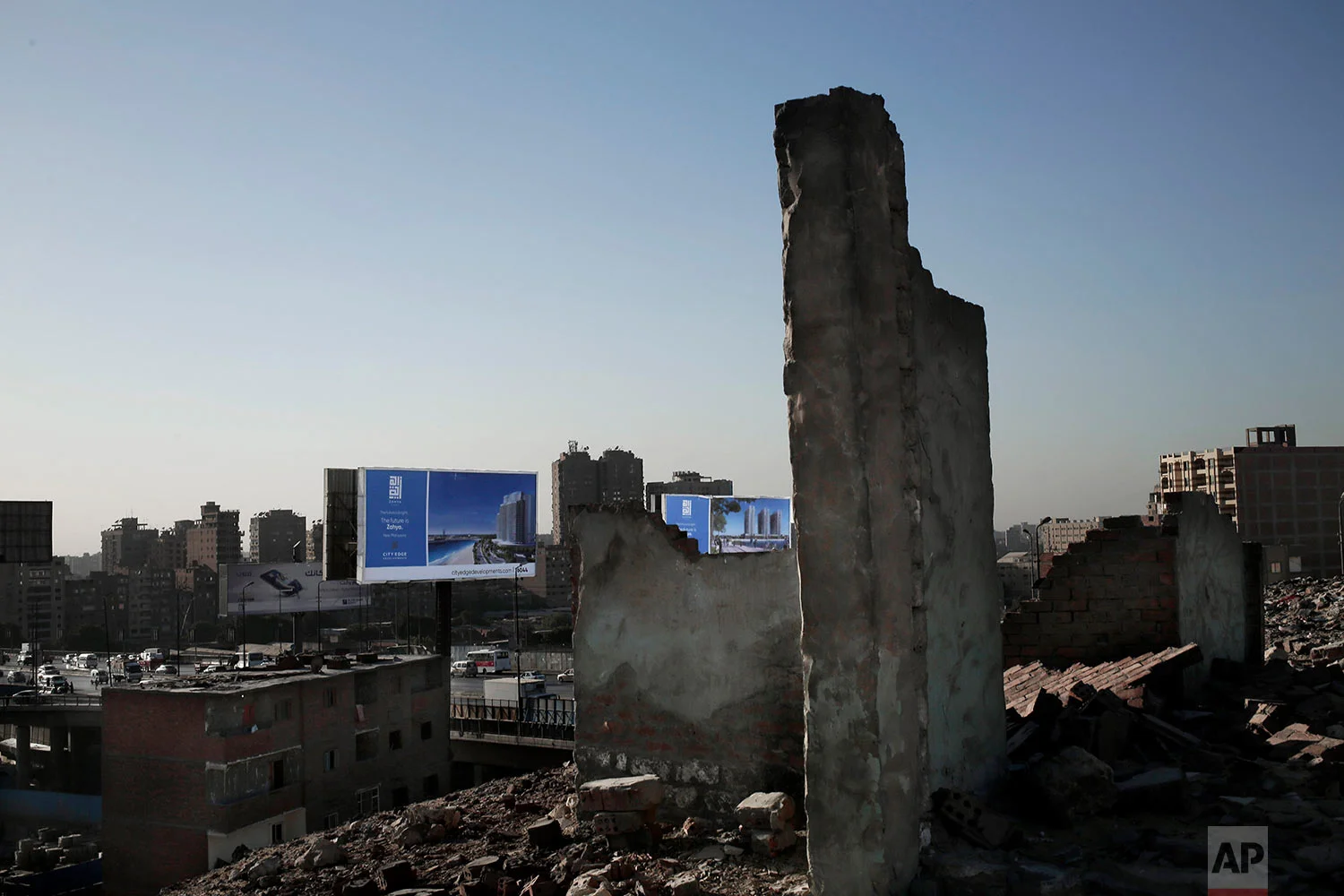 This Oct. 28, 2018 photo, shows billboard advertisements from slum area Ezbet Khairallah, in Cairo, Egypt. (AP Photo/Nariman El-Mofty)