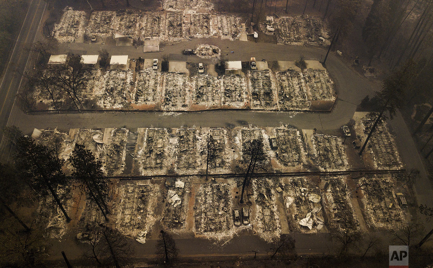 This aerial photo shows the remains of residences leveled by the wildfire in Paradise, Calif., on Thursday, Nov. 15, 2018. (AP Photo/Noah Berger)