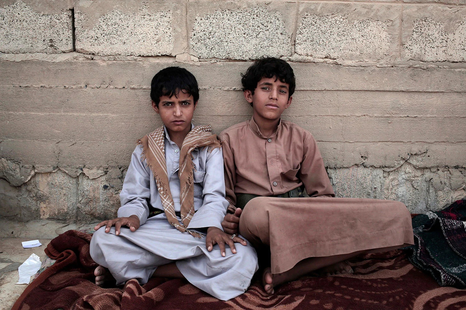 In this July 27, 2018 photo, 14 year-old Morsal Al Amery, right, and 14 year-old Abdel Hamid Saleh, pose for a photograph at a camp for displaced persons where they took shelter, in Marib, Yemen, (AP Photo/Nariman El-Mofty)