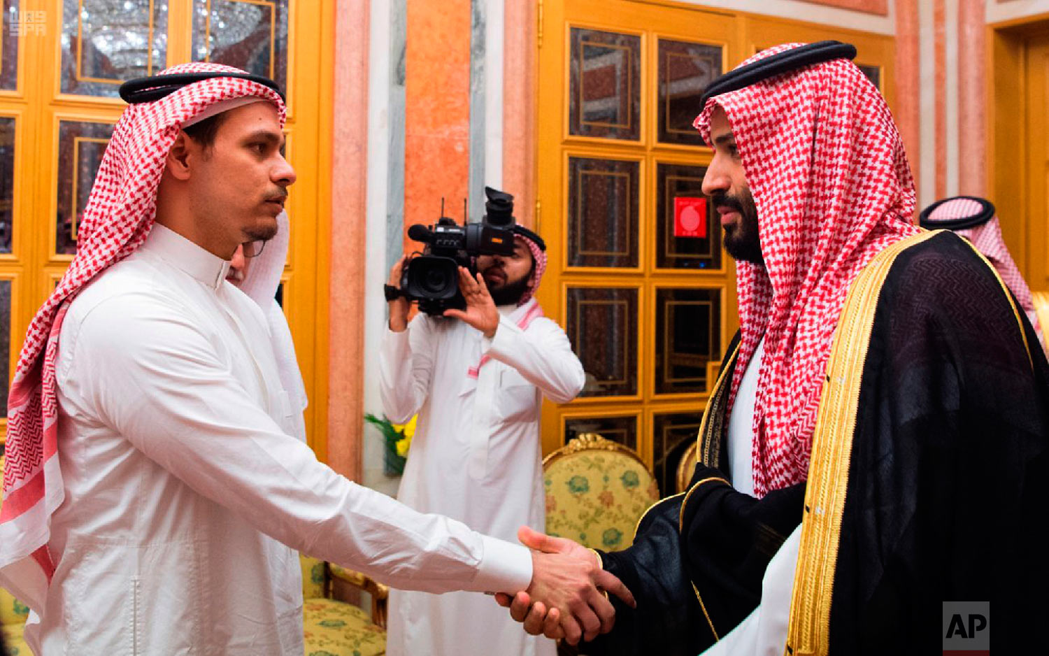  In this photo released by the Saudi Press Agency, Saudi Crown Prince Mohammed bin Salman, right, shakes hands with Salah Khashoggi, a son of Jamal Khashoggi, in Riyadh, Saudi Arabia, on Oct. 23, 2018. The meeting came just days after Saudi Arabia ac