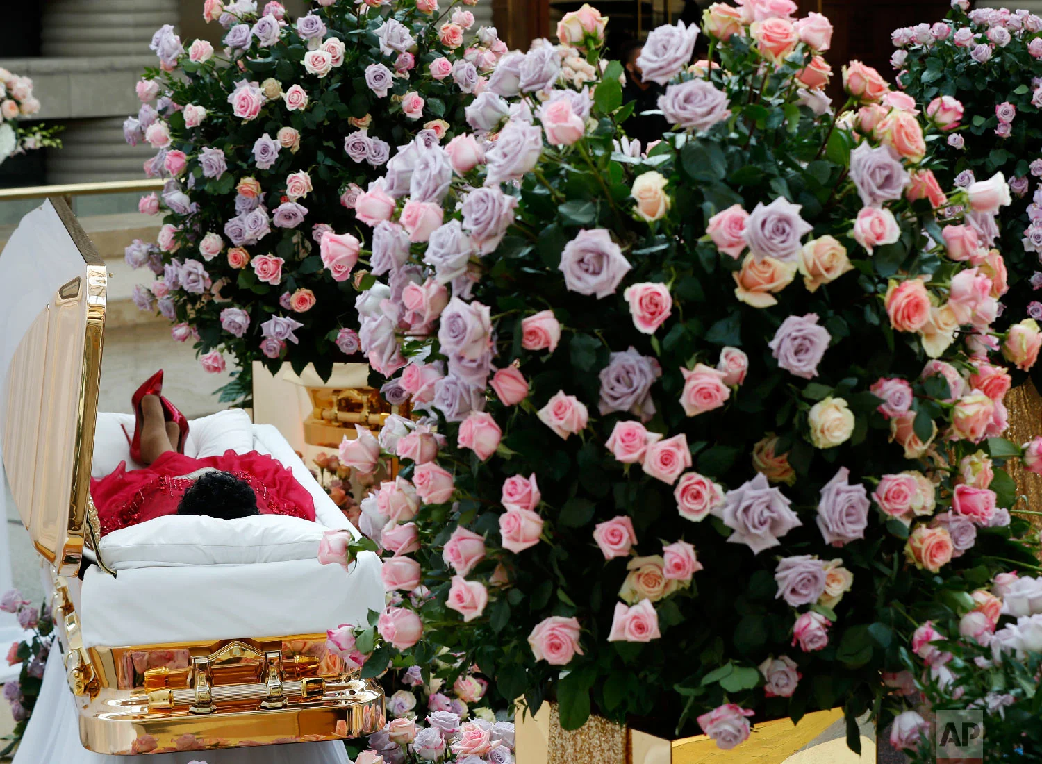 Aretha Franklin lies in her casket at the Charles H. Wright Museum of African American History in Detroit during a public visitation on Aug. 28, 2018. Franklin died on Aug. 16 of pancreatic cancer at the age of 76. (AP Photo/Paul Sancya, Pool)