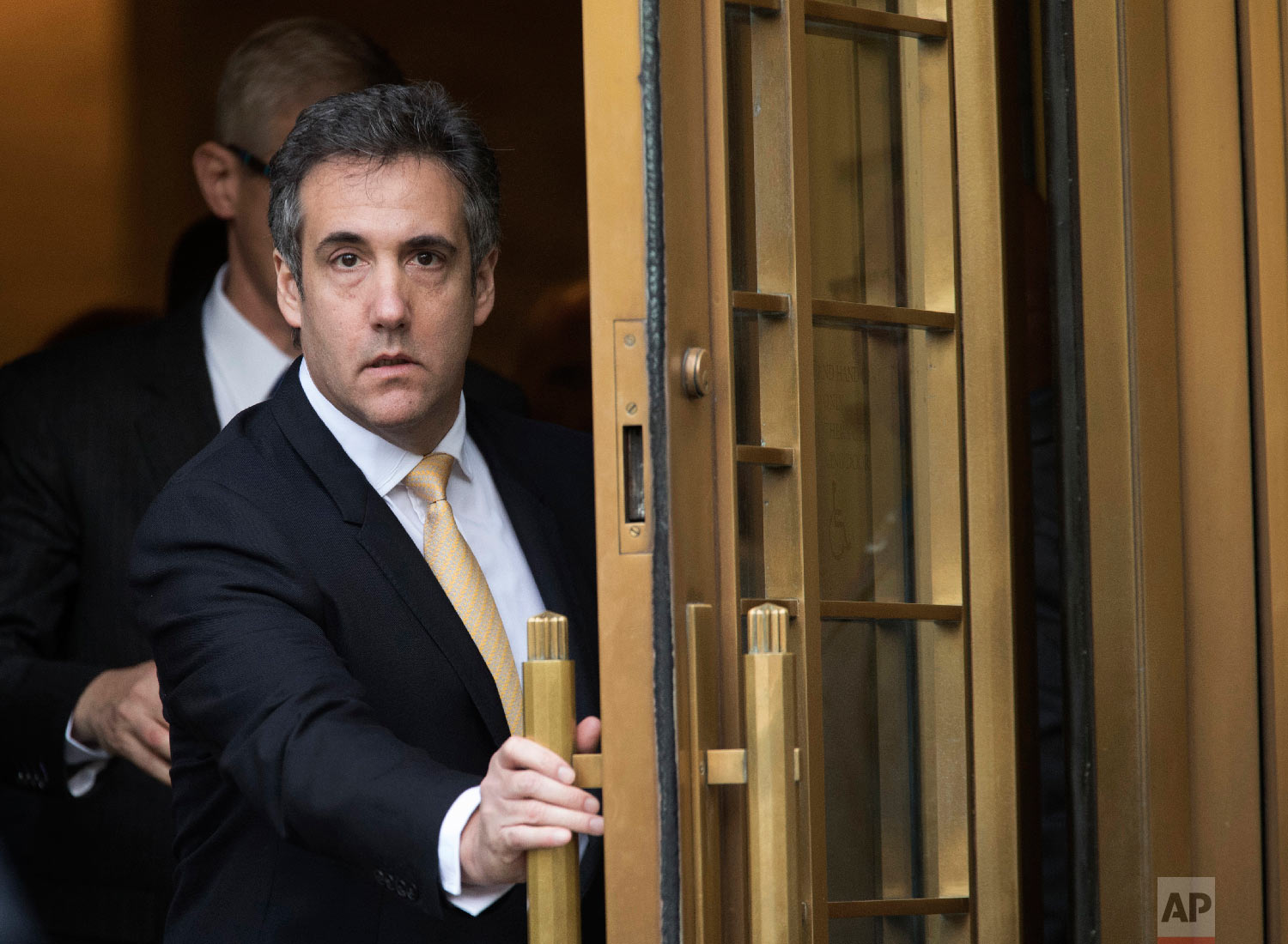 Michael Cohen leaves Federal court in New York on Aug. 21, 2018, after pleading guilty to charges including campaign finance fraud stemming from hush money payments to porn actress Stormy Daniels and ex-Playboy model Karen McDougal. (AP Photo/Mary A