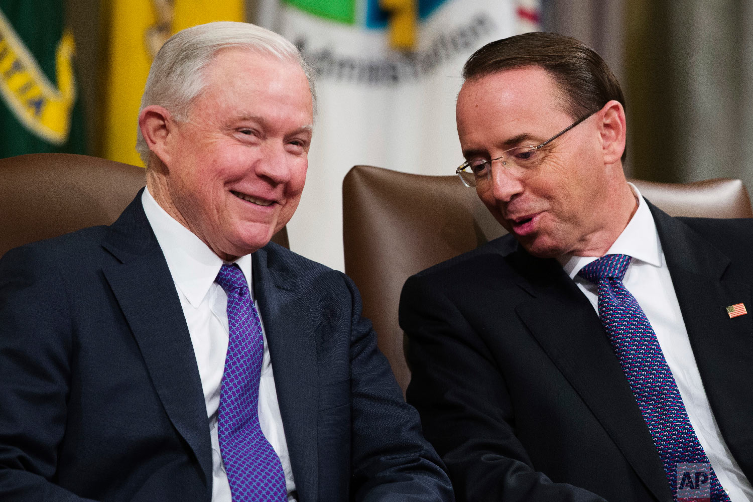  Attorney General Jeff Sessions, left, and Deputy Attorney General Rod Rosenstein, talk during an event to announce new strategic actions to combat the opioid crisis at the Department of Justice's National Opioid Summit in Washington on Oct. 25, 2018