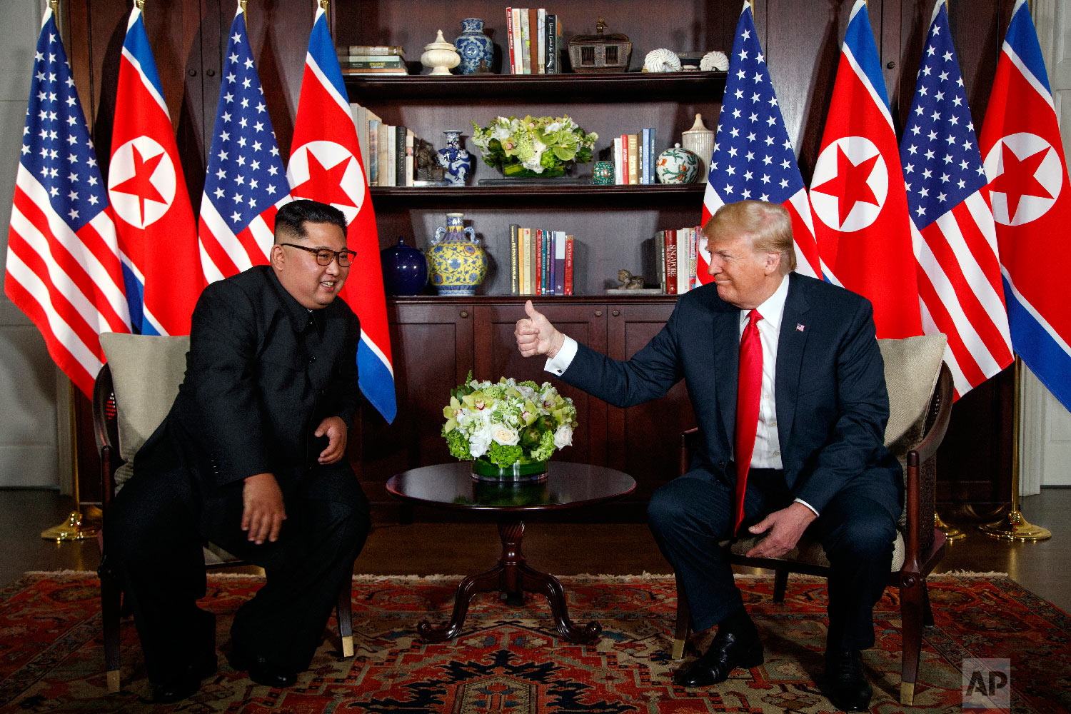  President Donald Trump meets with North Korean leader Kim Jong Un on Sentosa Island in Singapore on June 12, 2018. (AP Photo/Evan Vucci) 