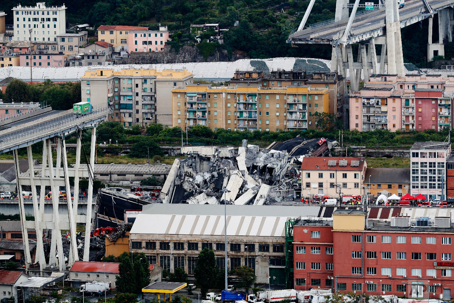  Cars are blocked on the Morandi highway bridge after a large section of it collapsed in Genoa, Italy, on Aug. 14, 2018, during a sudden and violent storm. (AP Photo/Antonio Calanni) 