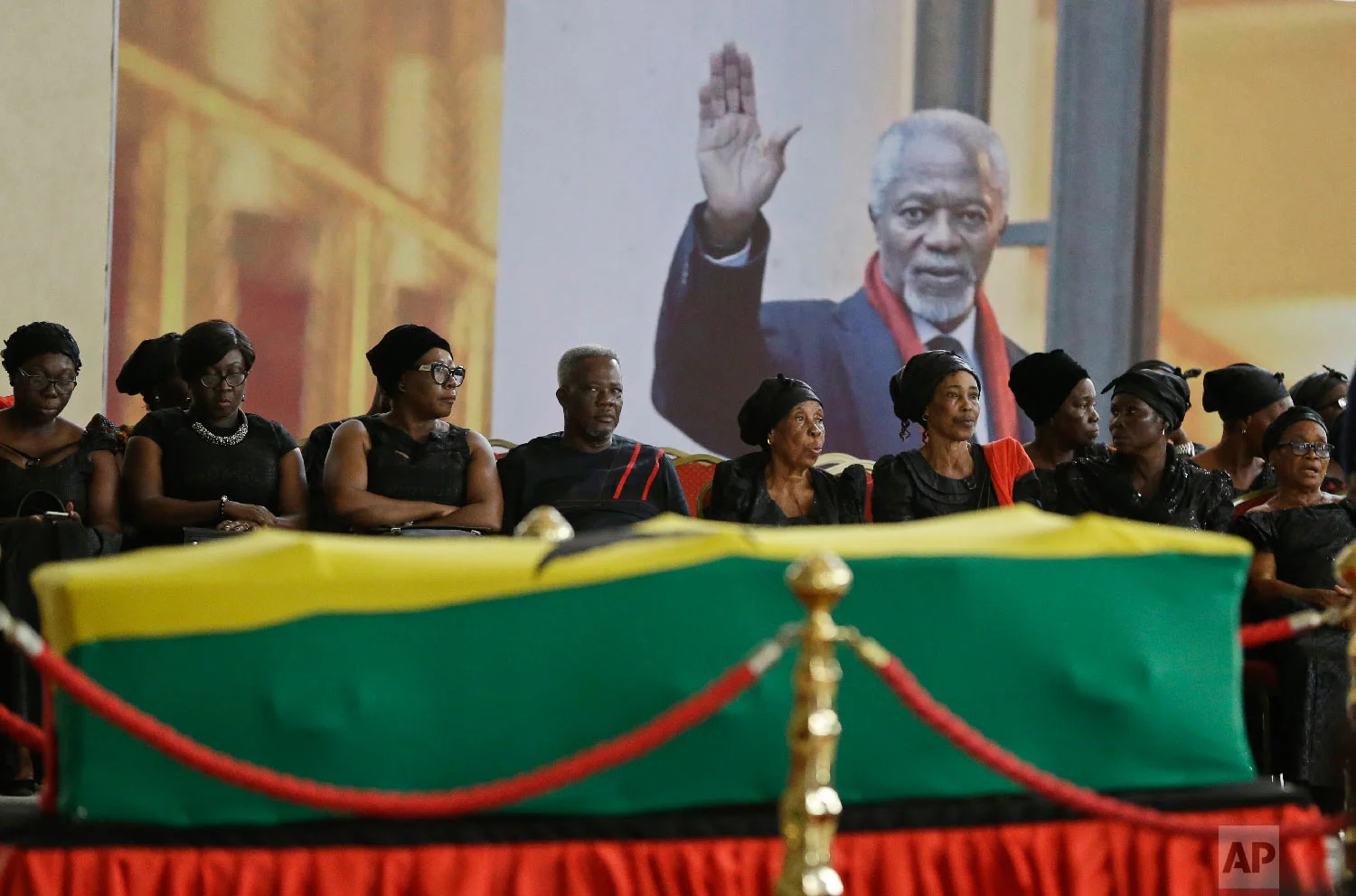 Mourners pay their respects at the coffin of former United Nations Secretary-General Kofi Annan at the Accra International Conference Center in Ghana on Sept. 11, 2018. Annan died in Switzerland at age 80. (AP Photo/Sunday Alamba)