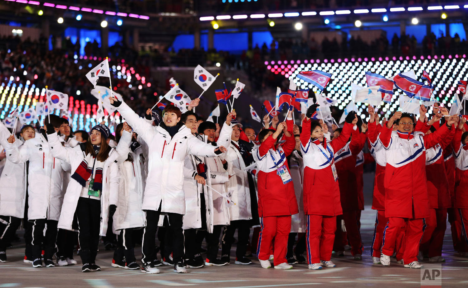  North and South Koreans wave flags together during the closing ceremony of the 2018 Winter Olympics in Pyeongchang, South Korea, on Feb. 25, 2018. (AP Photo/Natacha Pisarenko) 