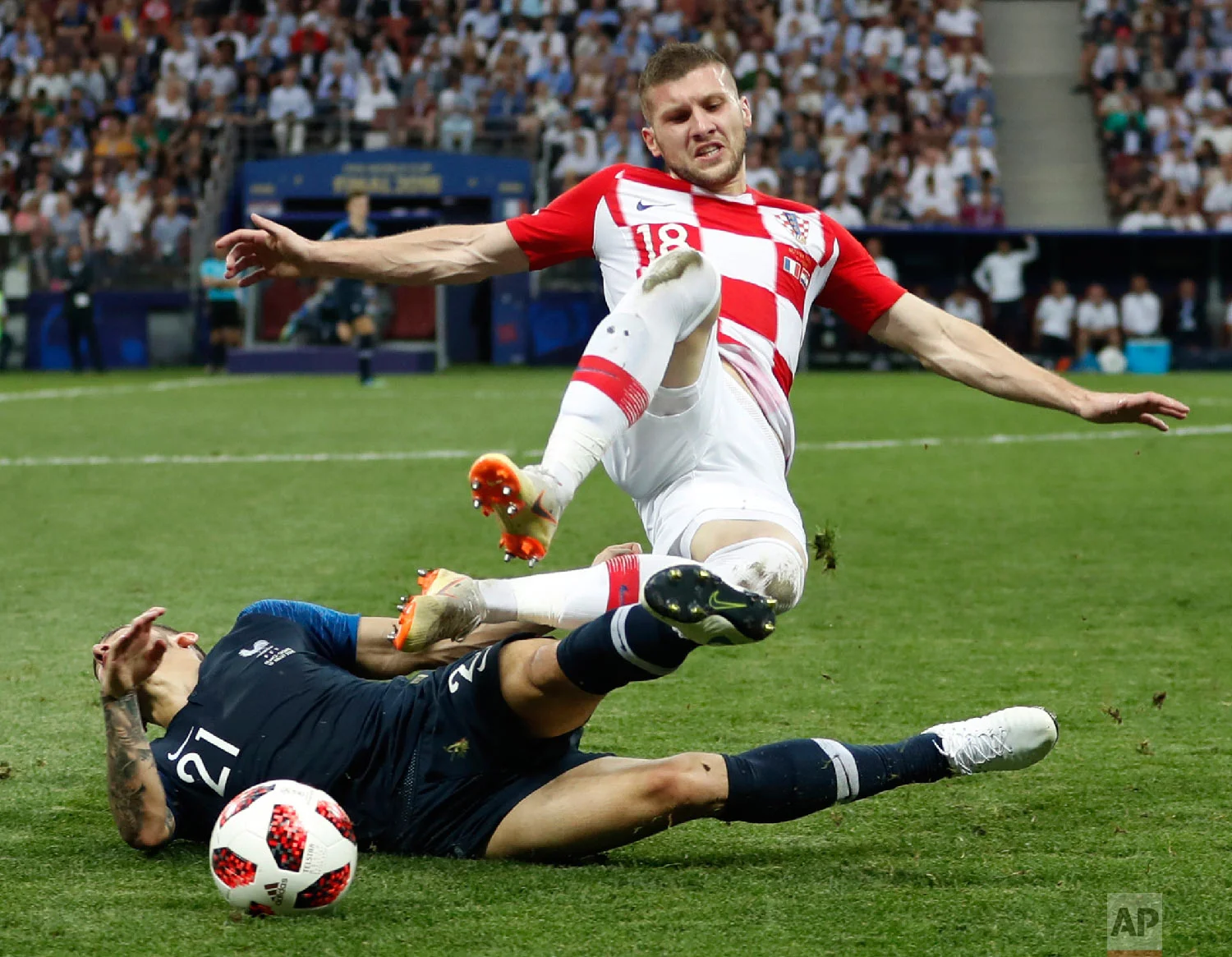 Croatia's Ante Rebic, top, tackles France's Lucas Hernandez during the final match between France and Croatia at the 2018 soccer World Cup in the Luzhniki Stadium in Moscow, Russia, on July 15, 2018. (AP Photo/Francisco Seco)