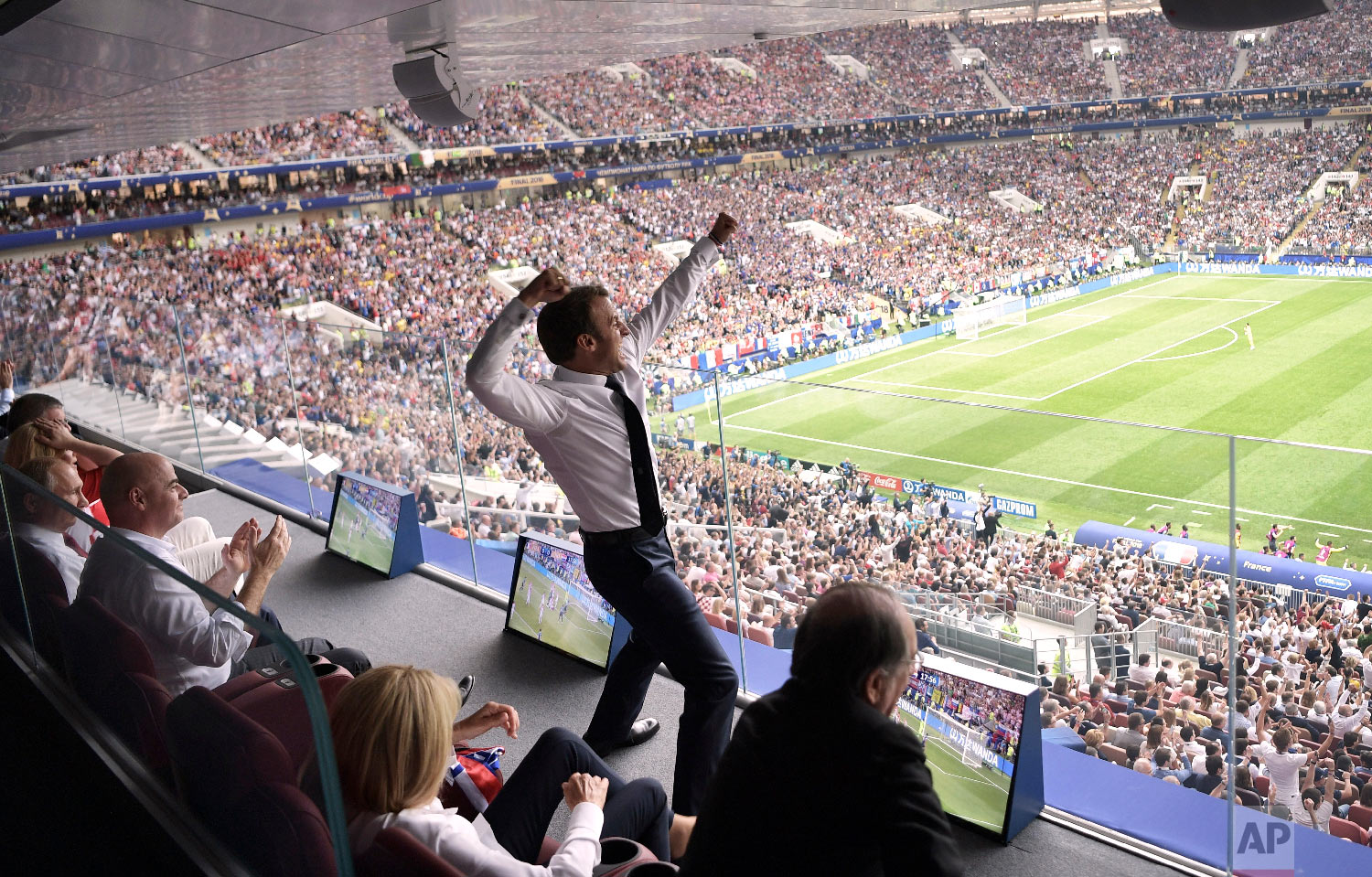  French President Emmanuel Macron cheers during the final match between France and Croatia at the 2018 soccer World Cup in the Luzhniki Stadium in Moscow, Russia, on July 15, 2018. (Alexei Nikolsky/Sputnik/Kremlin Pool Photo via AP) 