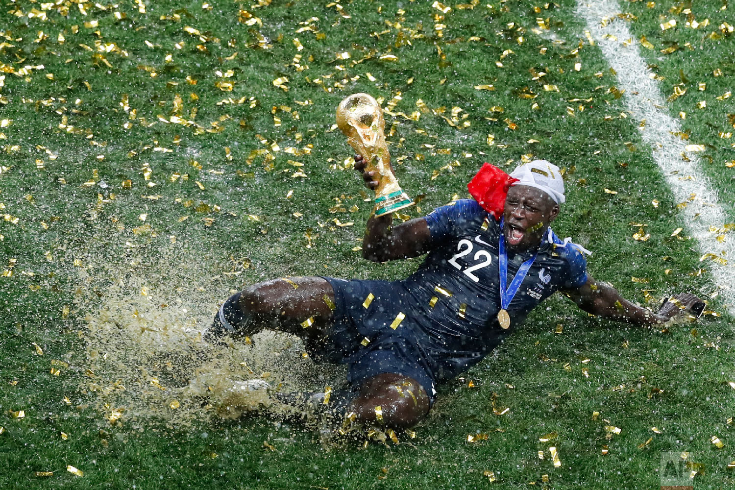  France's Benjamin Mendy celebrates with the trophy after his team won the final match against Croatia at the 2018 soccer World Cup in the Luzhniki Stadium in Moscow, Russia, on July 15, 2018. (AP Photo/Rebecca Blackwell) 