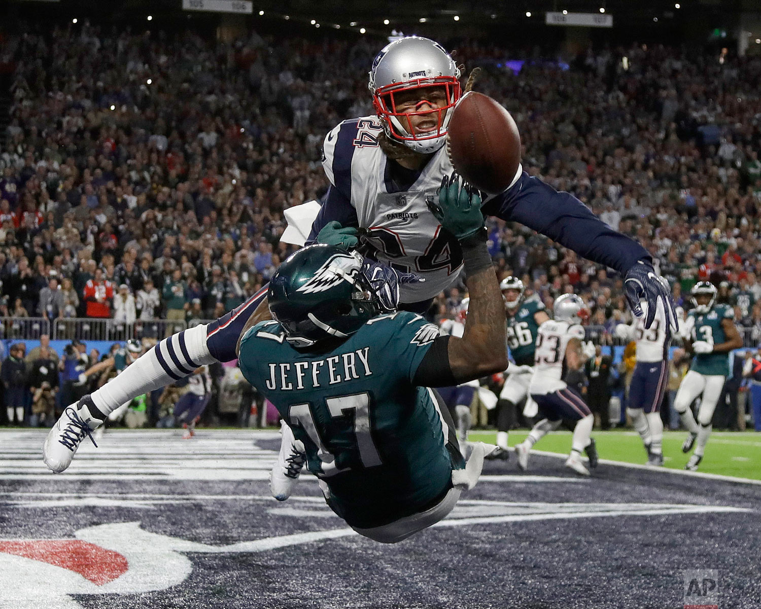  New England Patriots' Stephon Gilmore, top, breaks up a pass intended for Philadelphia Eagles' Alshon Jeffery during the first half of the NFL Super Bowl 52 football game on Feb. 4, 2018, in Minneapolis. (AP Photo/Matt Slocum) 