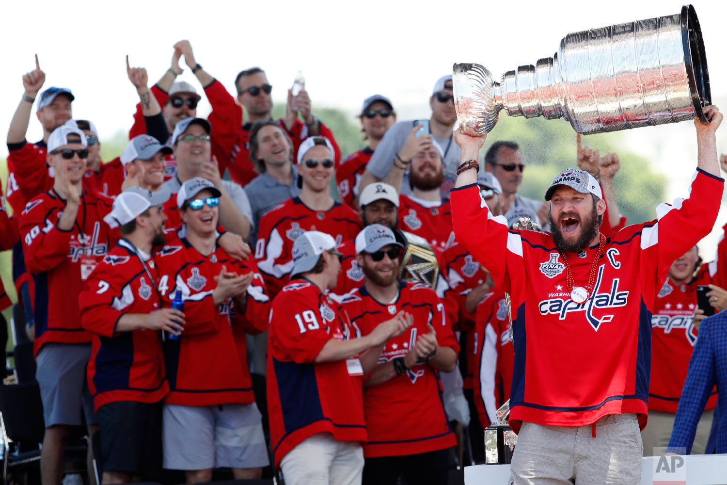  Washington Capitals Alex Ovechkin, of Russia, holds the Stanley Cup aloft during a victory rally on the National Mall in Washington on June 12, 2018. This was the first championship title for the Washington Capitals. (AP Photo/Jacquelyn Martin) 