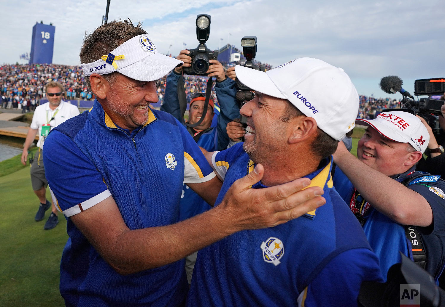  Europe's Sergio Garcia, right, celebrates with Ian Poulter after Europe won the Ryder Cup on the final day of the 42nd Ryder Cup at Le Golf National in Saint-Quentin-en-Yvelines, outside Paris, France, on Sept. 30, 2018. (AP Photo/Laurent Cipriani) 