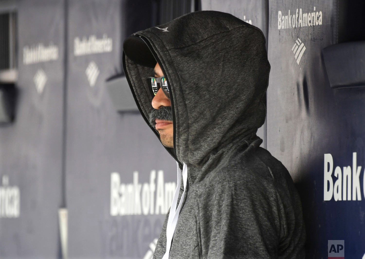  Ichiro Suzuki, special assistant to the chairman of the Seattle Mariners, sits in the dugout disguised with a fake mustache and a hoodie as he watches the New York Yankees bat during the first inning of a baseball game on June 21, 2018, at Yankee St