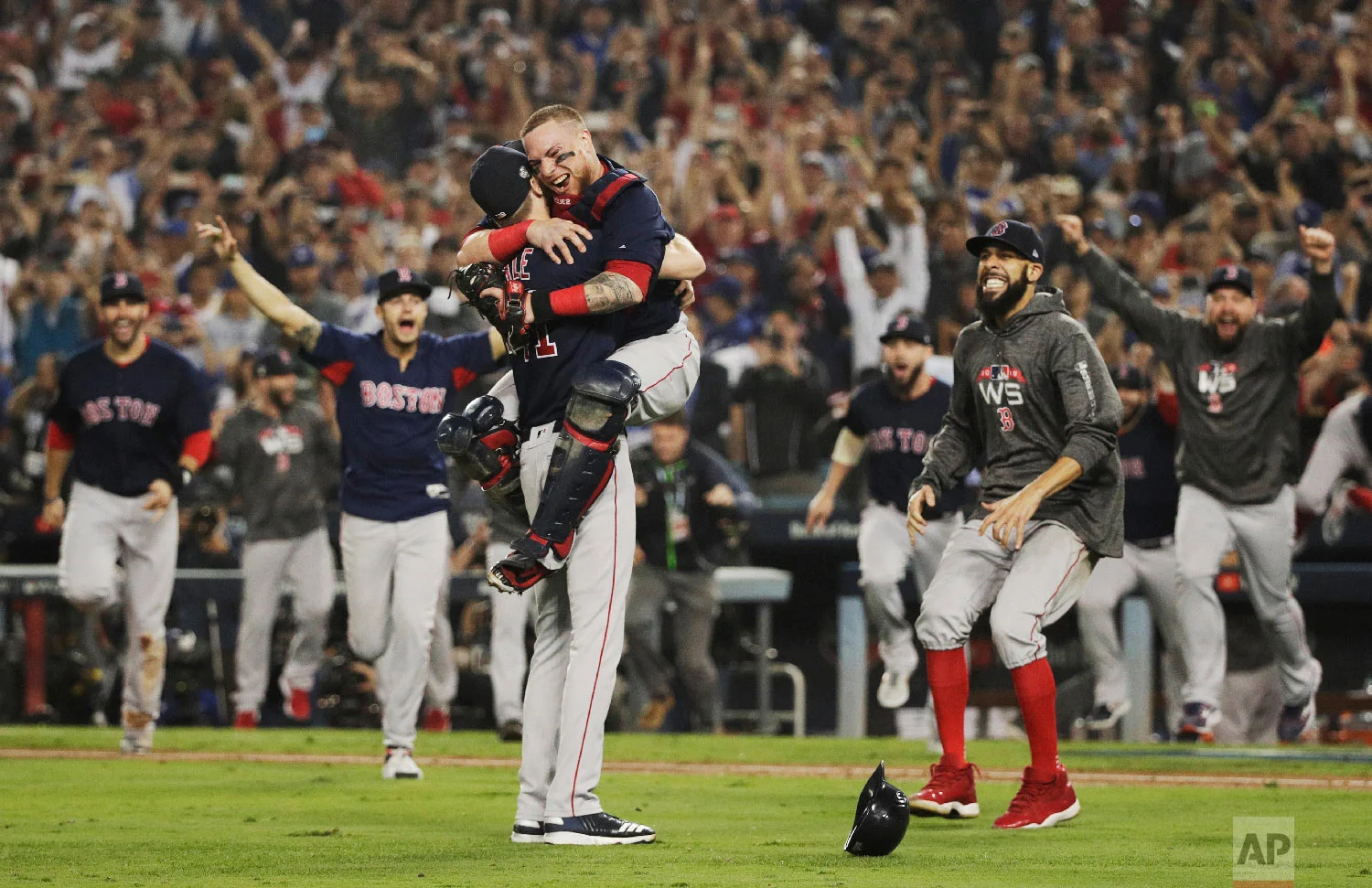 The Boston Red Sox celebrate after Game 5 of baseball's World Series against the Los Angeles Dodgers on Oct. 28, 2018, in Los Angeles. The Red Sox won the game 5-1 to win the series 4 games to 1. (AP Photo/Jae C. Hong)
