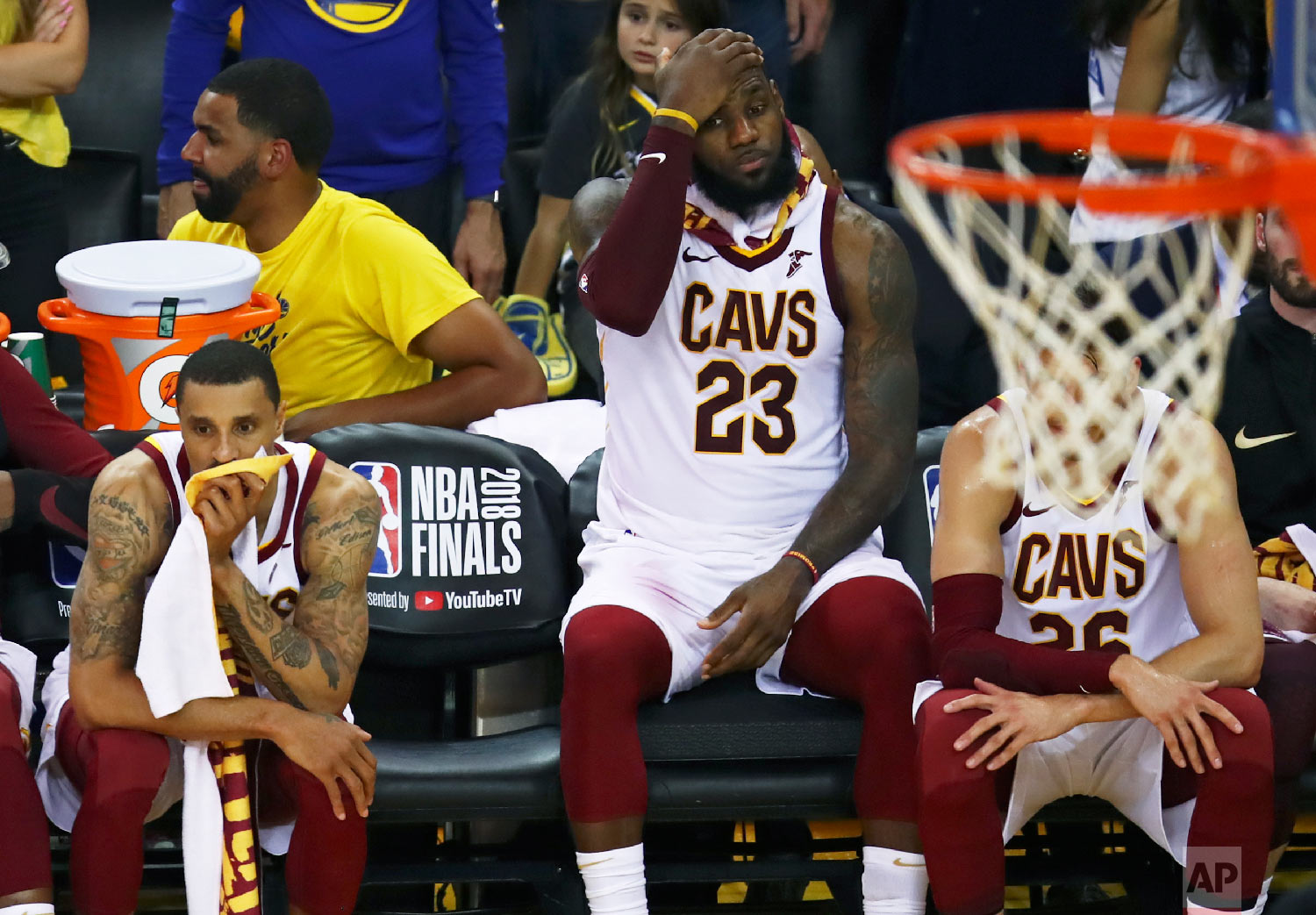  Cleveland Cavaliers forward LeBron James (23) sits on the bench between guards George Hill, left, and Kyle Korver during the second half of Game 2 of basketball's NBA Finals against the Golden State Warriors in Oakland, Calif., on June 3, 2018. The 
