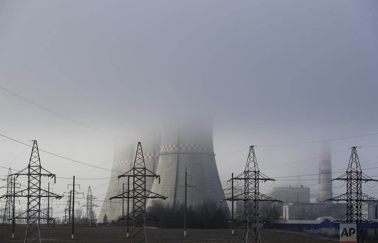  A power plant is partially obscured by fog in Minsk, Belarus, on Thursday, Dec. 6, 2018. The two-week U.N. climate meeting COP24 in Poland is intended to finalize details of the 2015 Paris accord on keeping average global temperature increases well 