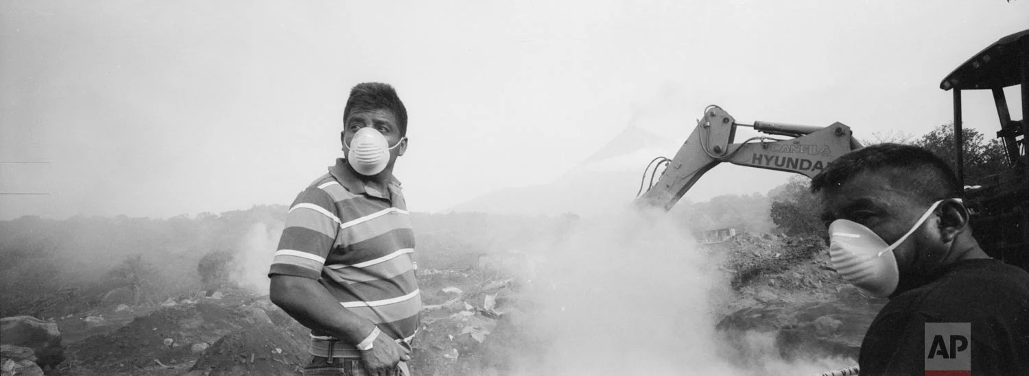 Elmer Vazquez stands amid volcanic ash and dust as he searches for the remains of his wife and five children who were killed by the eruption of the Volcan de Fuego, or Volcano of Fire, at his home buried in volcanic ash in San Miguel Los Lotes, Guatemala, June 14, 2018. (AP Photo/Rodrigo Abd)