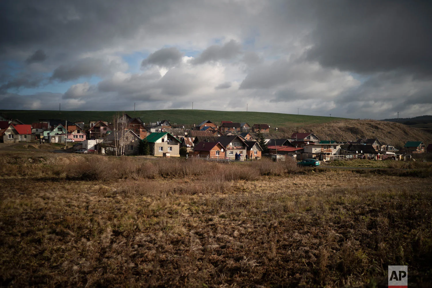 Dark clouds hover over Podhorany village after a storm on Nov. 14, 2018, near Kezmarok, Slovakia. (AP Photo/Felipe Dana)