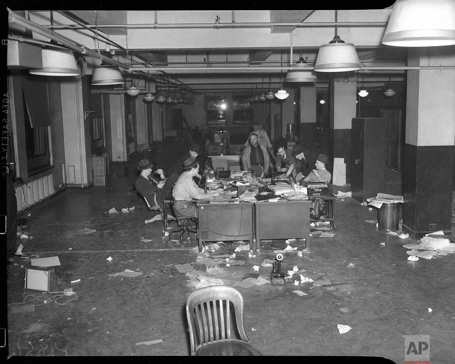  This photo shows the final days of reporters working at the 383 Madison Ave. office prior to the completion of the move to Rockefeller Center in New York, in Dec. 1938. (AP Photo/Corporate Archives) 