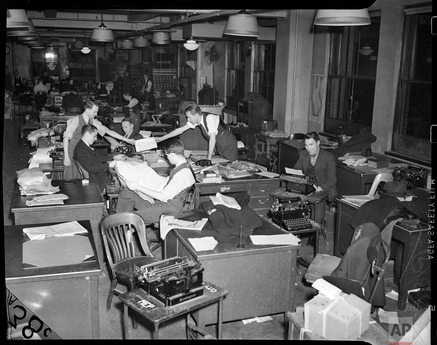  This undated photo shows reporters working at the 383 Madison Ave. office in New York. (AP Photo/Corporate Archives) 