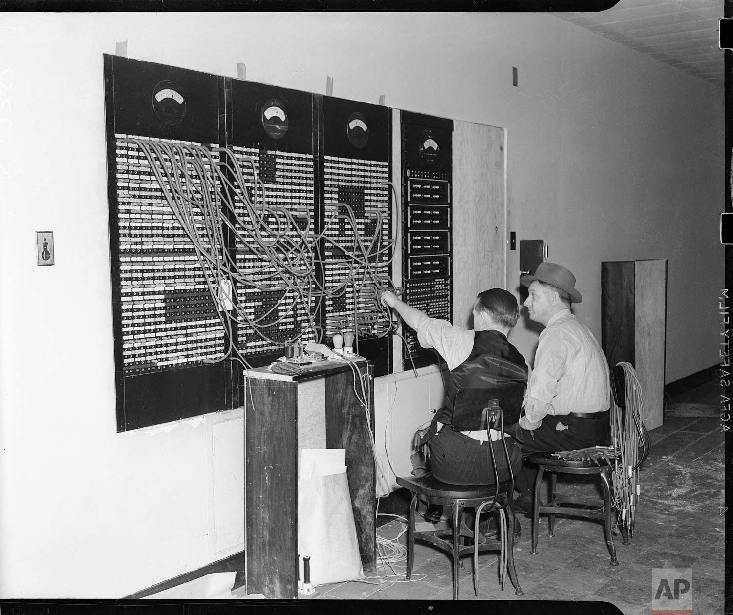  Here is the front of the master switchboard in the new Associated Press building in Rockefeller Center in New York, Dec. 18, 1938. This switchboard, comprising 157 circuits links 285,000 miles of leased wires. (AP Photo/Corporate Archives) 