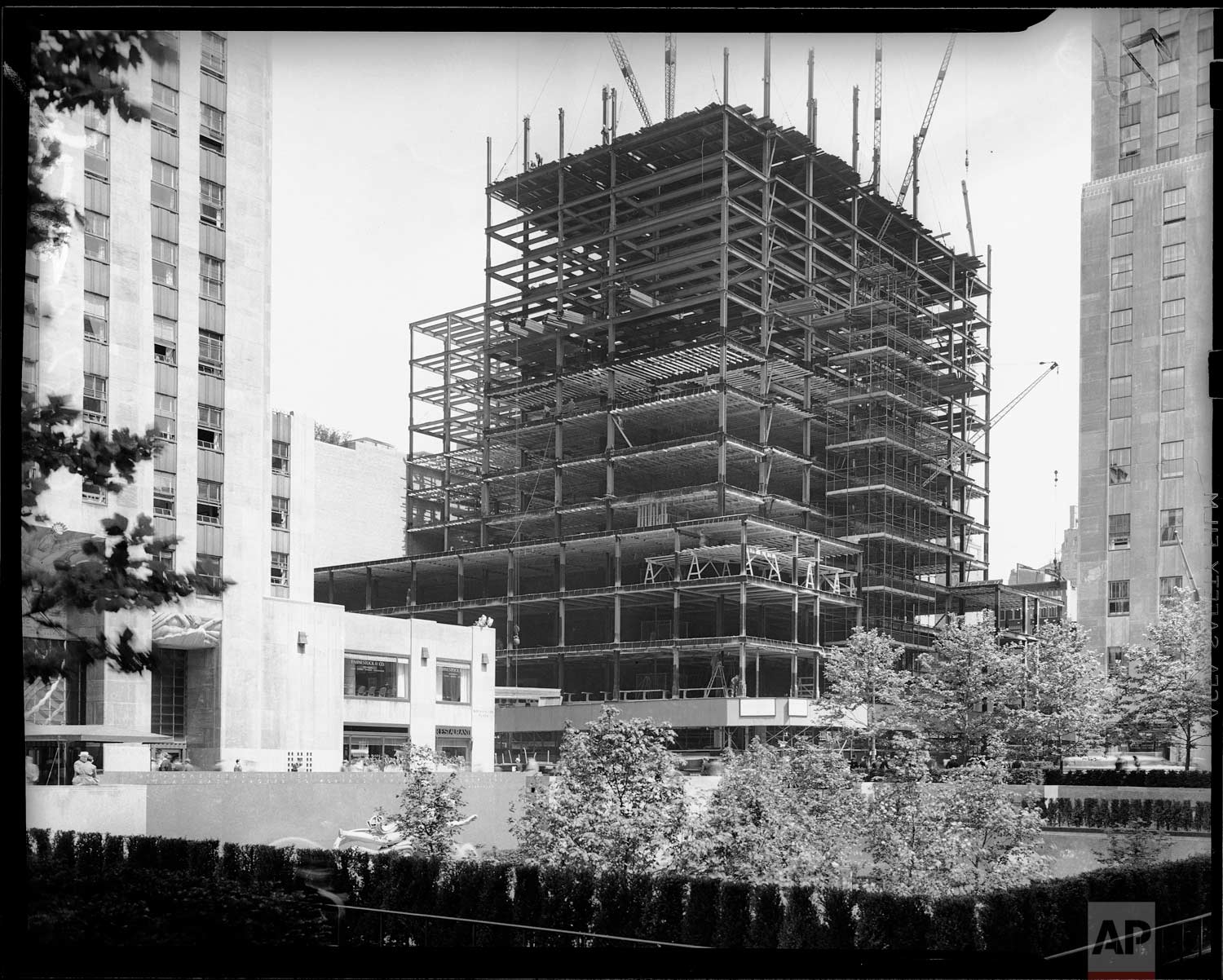  The swiftly growing steel skeleton of the new Associated Press building is shown under construction at Rockefeller Center, New York, June 10, 1938. (AP Photo/Corporate Archives/Joseph W. Brady) 