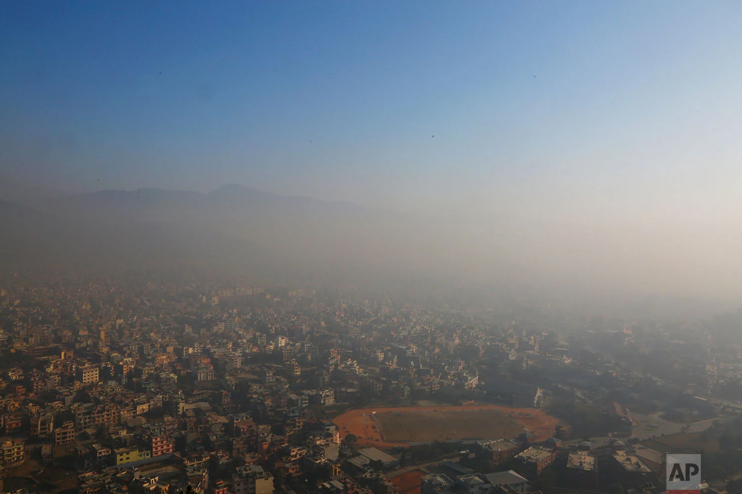 In this Tuesday, Dec. 11, 2018 photo, the smog ridden Kathmandu city is seen atop of hill in Kathmandu, Nepal. (AP Photo/Niranjan Shrestha)