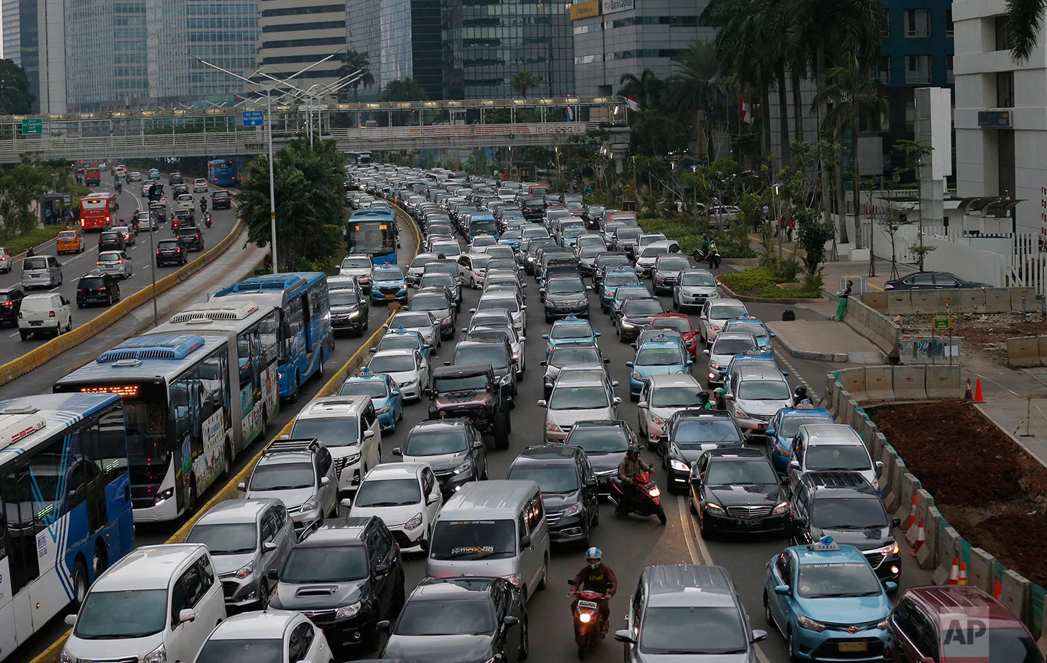 In this Tuesday, Dec. 11. 2018 photo, motorists are stuck in traffic jam during a rush hour at the main business district in Jakarta, Indonesia. (AP Photo/Tatan Syuflana)