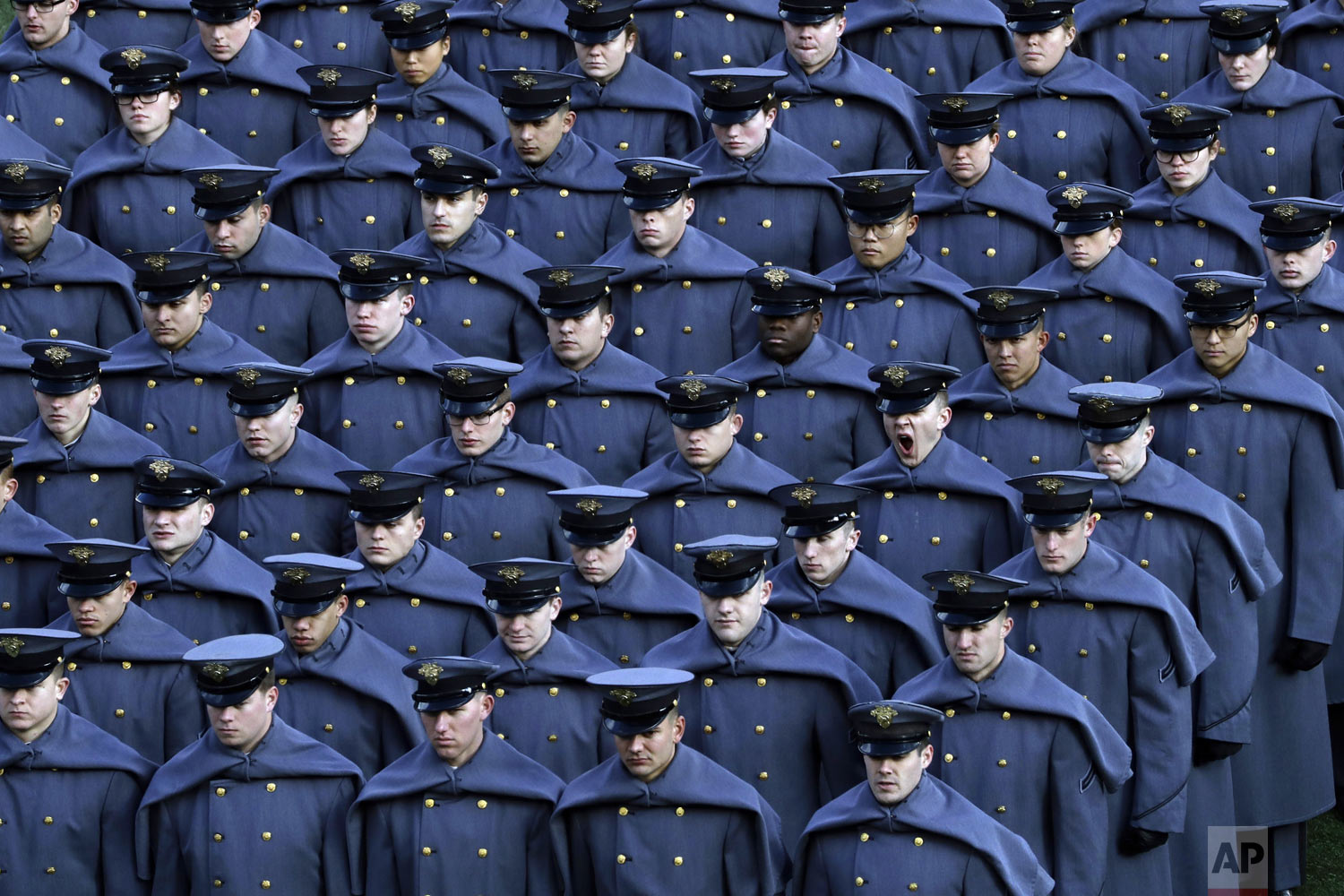  An Army cadet yawns after marching onto the field with others before an NCAA college football game against the Navy team in Philadelphia on Saturday, Dec. 8, 2018. (AP Photo/Matt Slocum) 