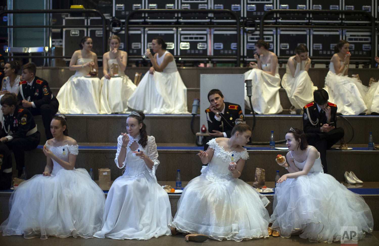  Military school students sit backstage during an annual ball in Moscow, Russia, Tuesday, Dec. 11, 2018. In a revival of a czarist tradition, more than 1,000 students both from military and general schools travelled to the capital from across the cou