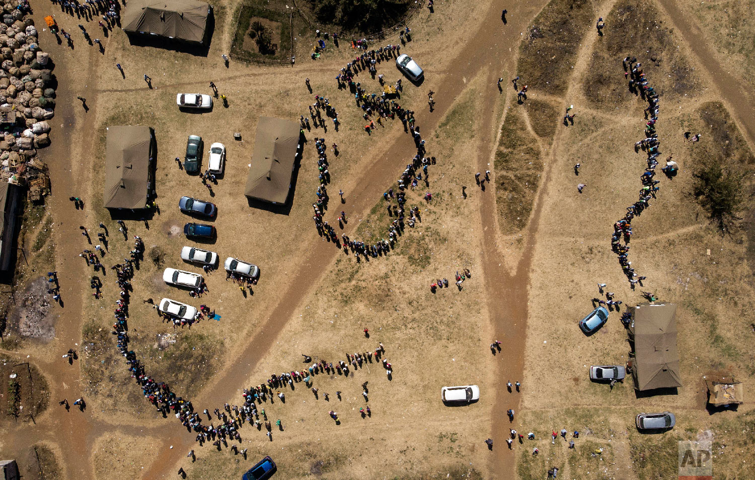  People wait in a queue to cast their vote at a polling station in Harare, Zimbabwe on July 30, 2018. Zimbabweans on Monday voted in their first election without Robert Mugabe on the ballot, a contest that could bring international legitimacy and inv