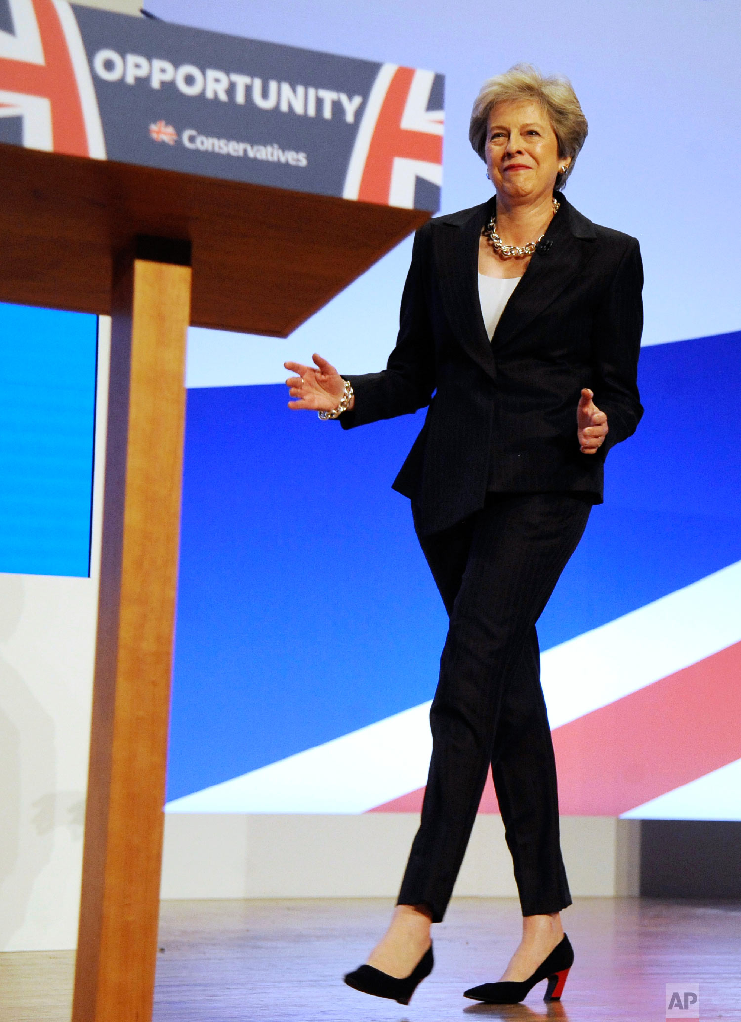  Conservative Party Leader and Prime Minister Theresa May dances as she arrives on stage to address delegates during a speech at the Conservative Party Conference at the ICC, in Birmingham, England on Oct. 3 , 2018. (AP Photo/Rui Vieira) 