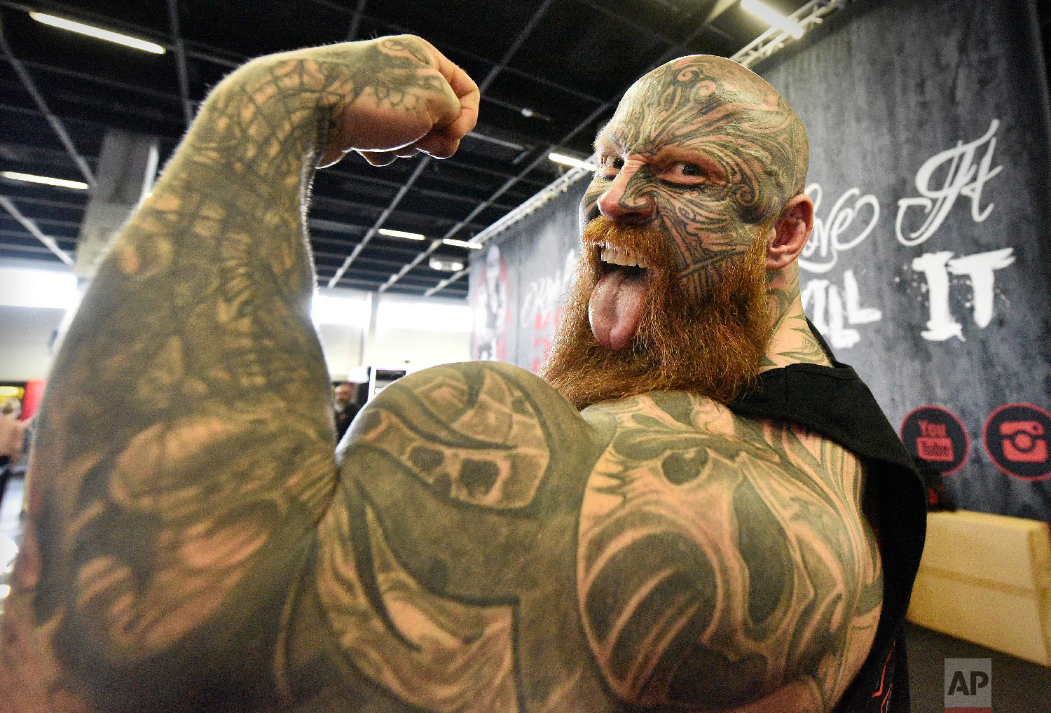 Bodybuilder Jens shows his muscles at the world's largest fitness trade show FIBO in Cologne, Germany on April 12, 2018. (AP Photo/Martin Meissner) 