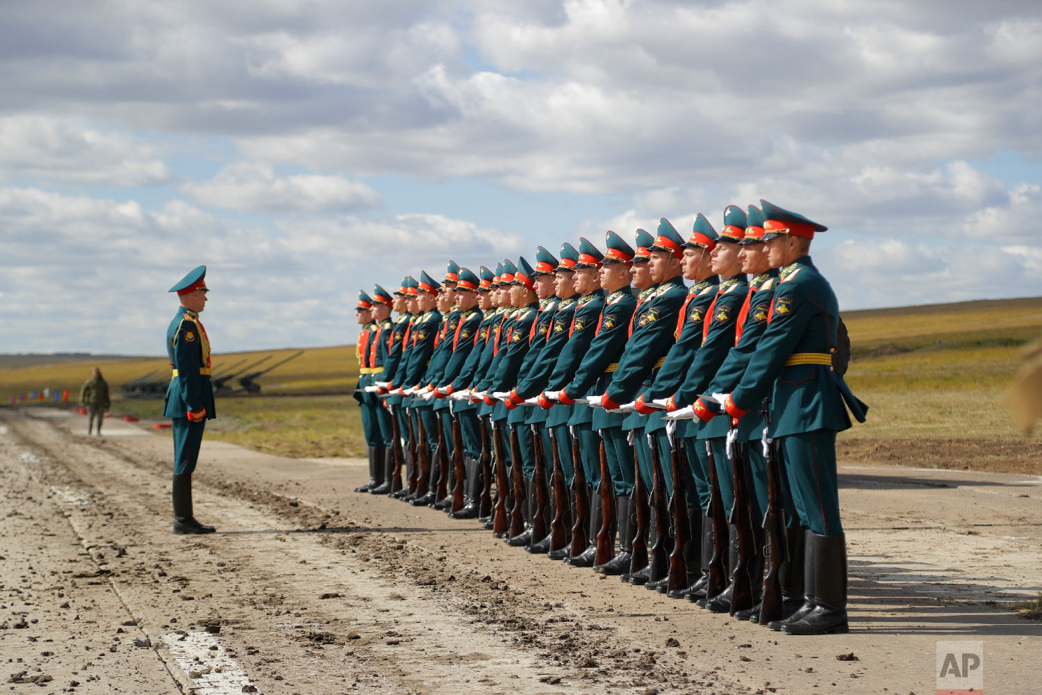  A Russian honor guard prepares to take a part in a parade prior to a military exercises on training ground "Tsugol", about 250 kilometers (156 miles ) south-east of the city of Chita during Vostok 2018 in Eastern Siberia, Russia on Sept. 13, 2018. (