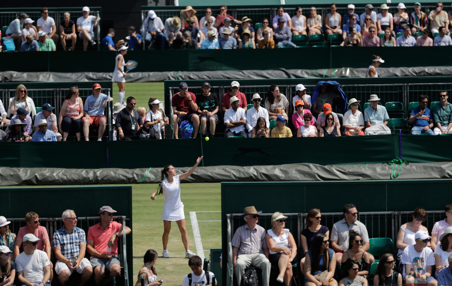  Eleonora Molinaro of Luxembourg serves to Natasha Subhash of the US during their girls' singles match on the sixth day at the Wimbledon Tennis Championships in London on July 7, 2018. (AP Photo/Ben Curtis) 