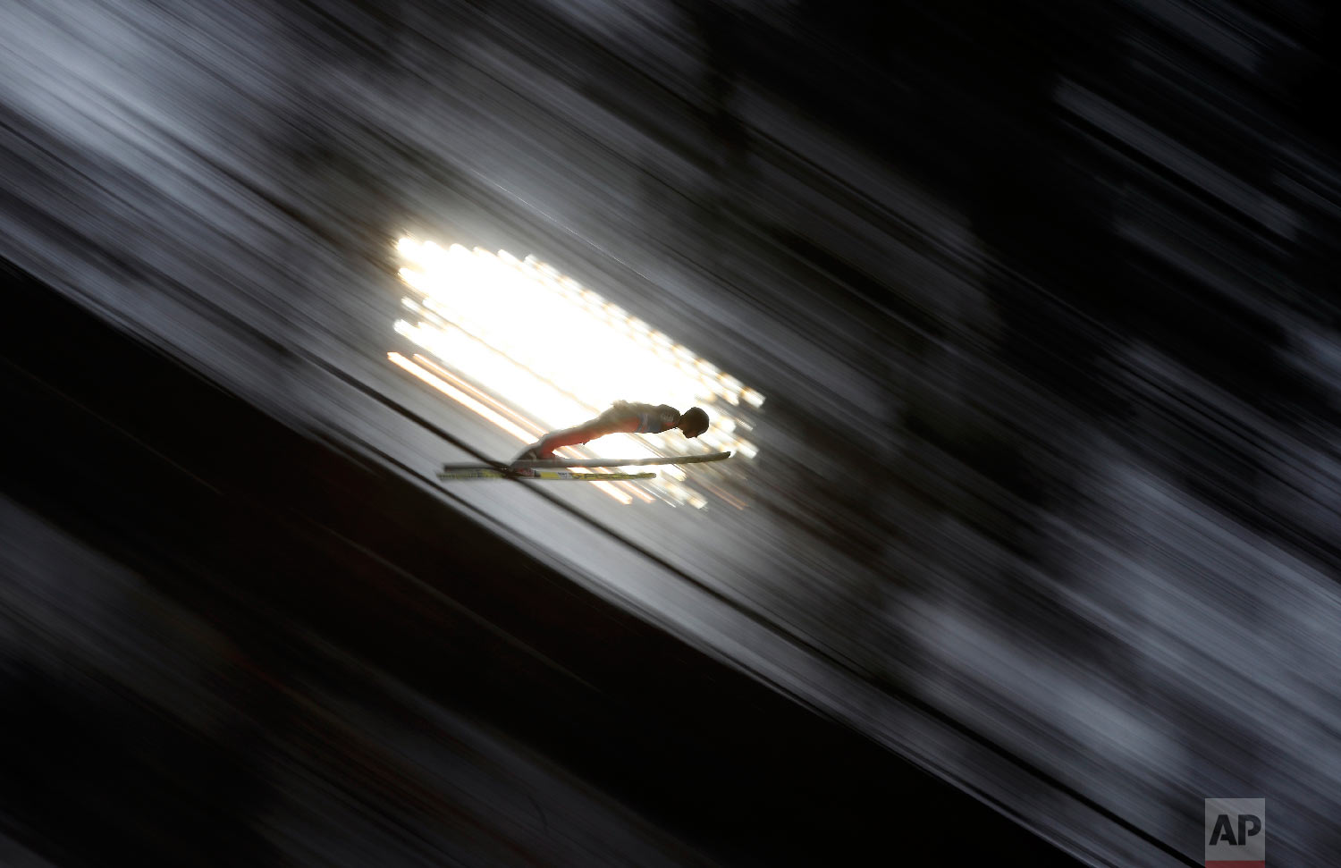  An unidentified athlete makes his trial jump at the ski jump in Bischofshofen, Austria, the fourth stage of the Four Hills Ski Jumping event on Jan. 5, 2018. (AP Photo/Matthias Schrader) 