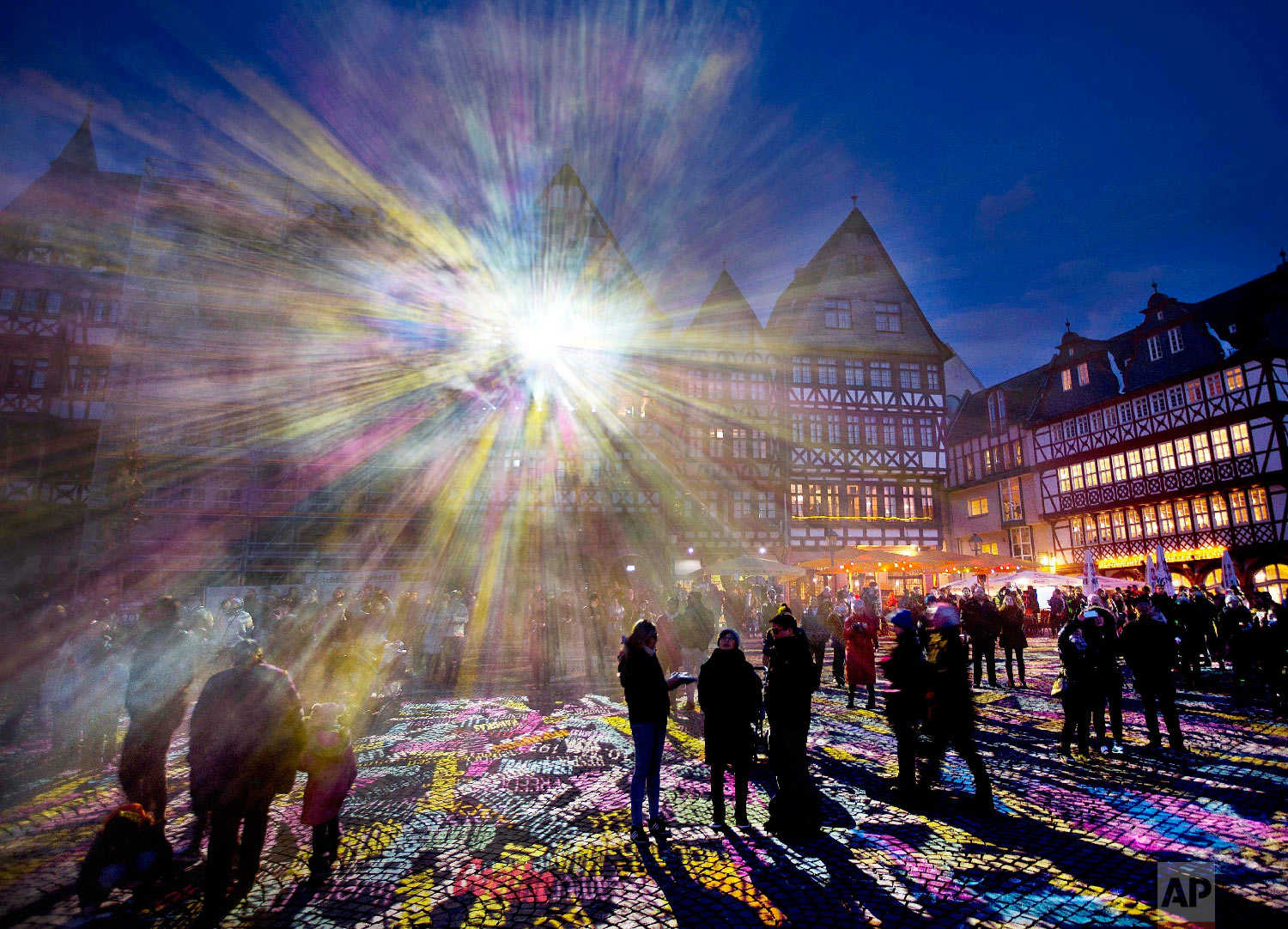  Light shines out from one of the buildings at Roemer Square during the official opening of the "Luminale" light festival in Frankfurt, Germany on March 20, 2018. (AP Photo/Michael Probst) 