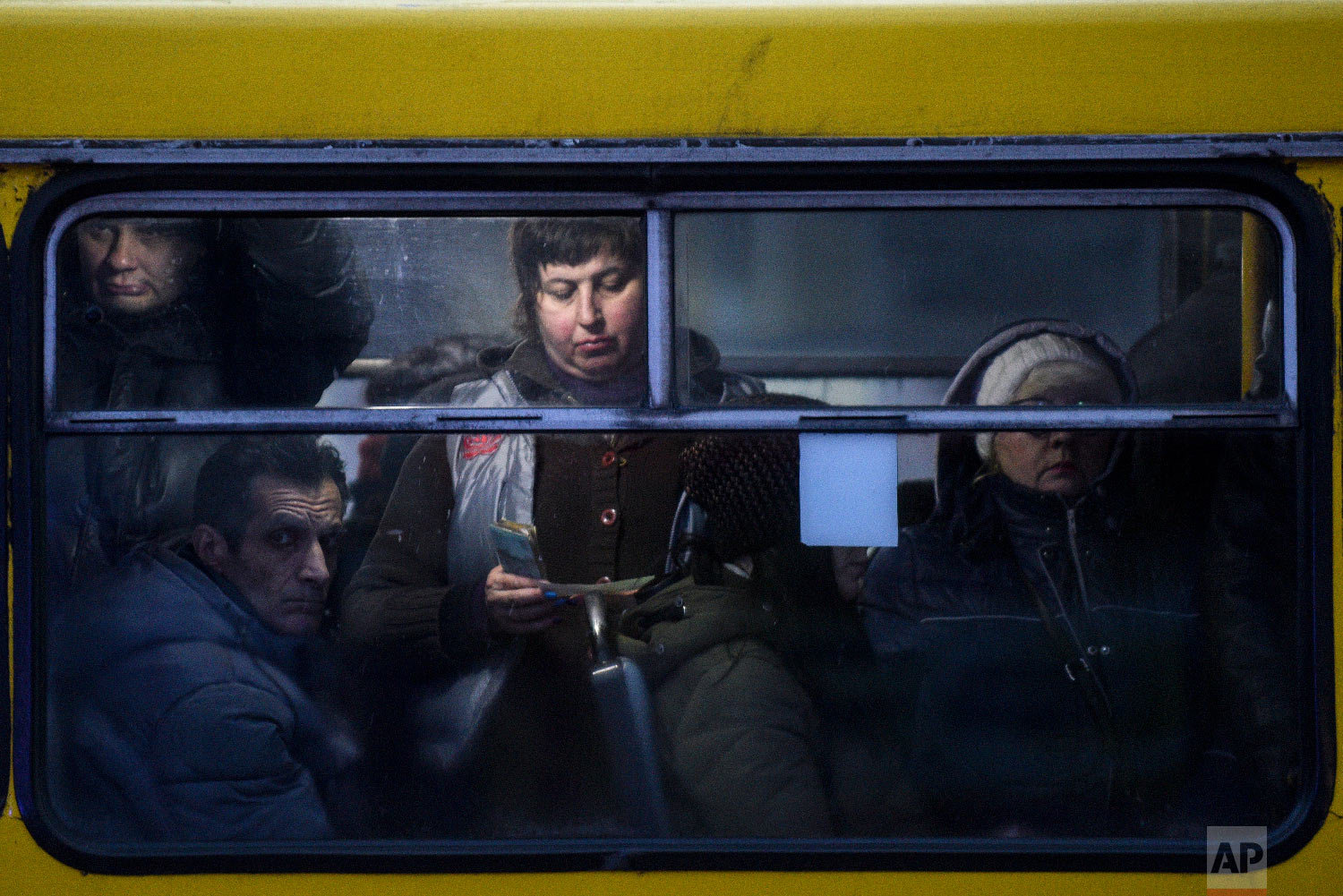  People ride a bus in Mariupol, south coast of Azov sea, eastern Ukraine on Nov. 30, 2018. (AP Photo/Evgeniy Maloletka) 