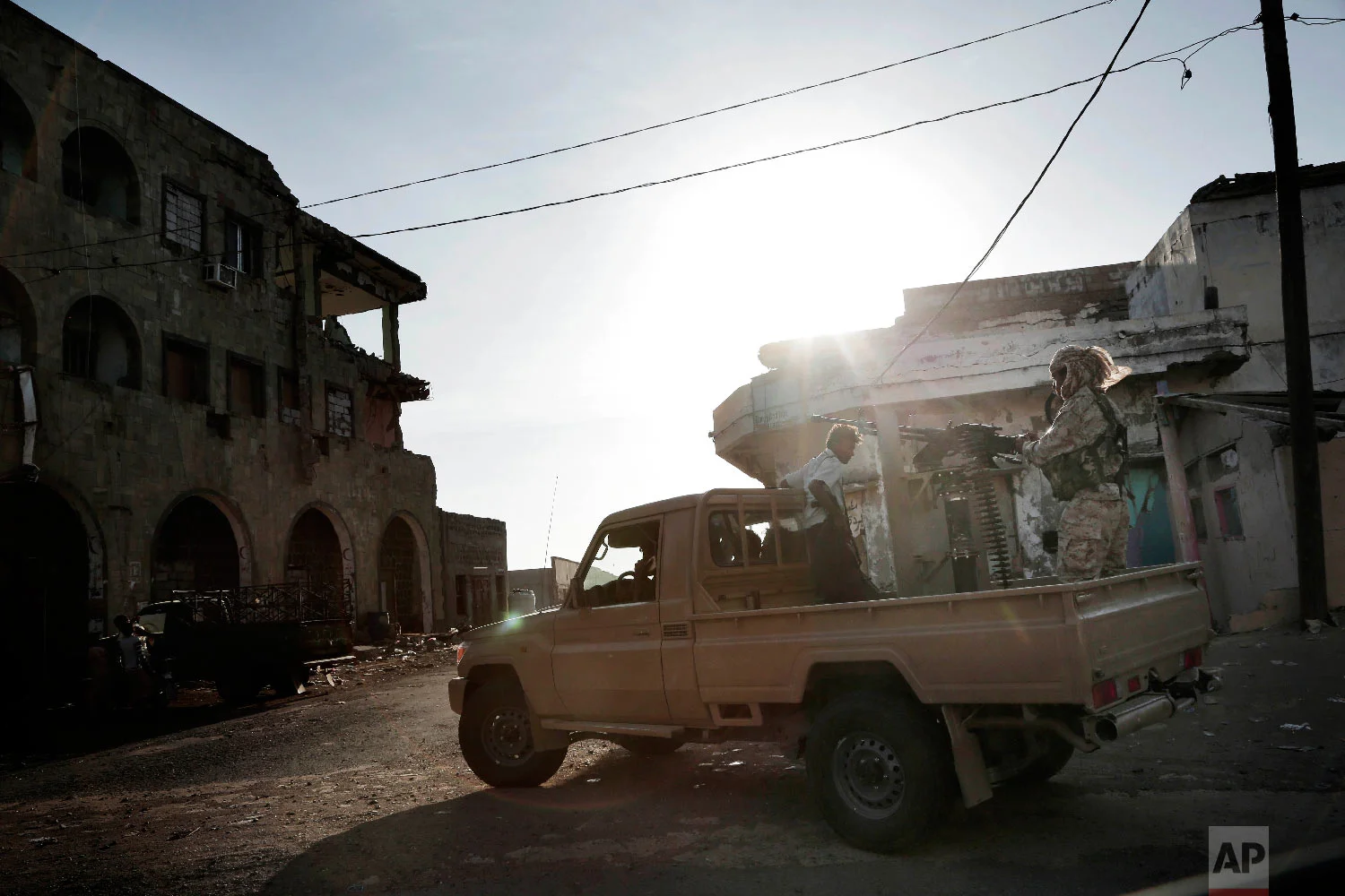 Saudi-led coalition backed forces patrol Mocha, Yemen, Feb. 12, 2018. (AP Photo/Nariman El-Mofty)