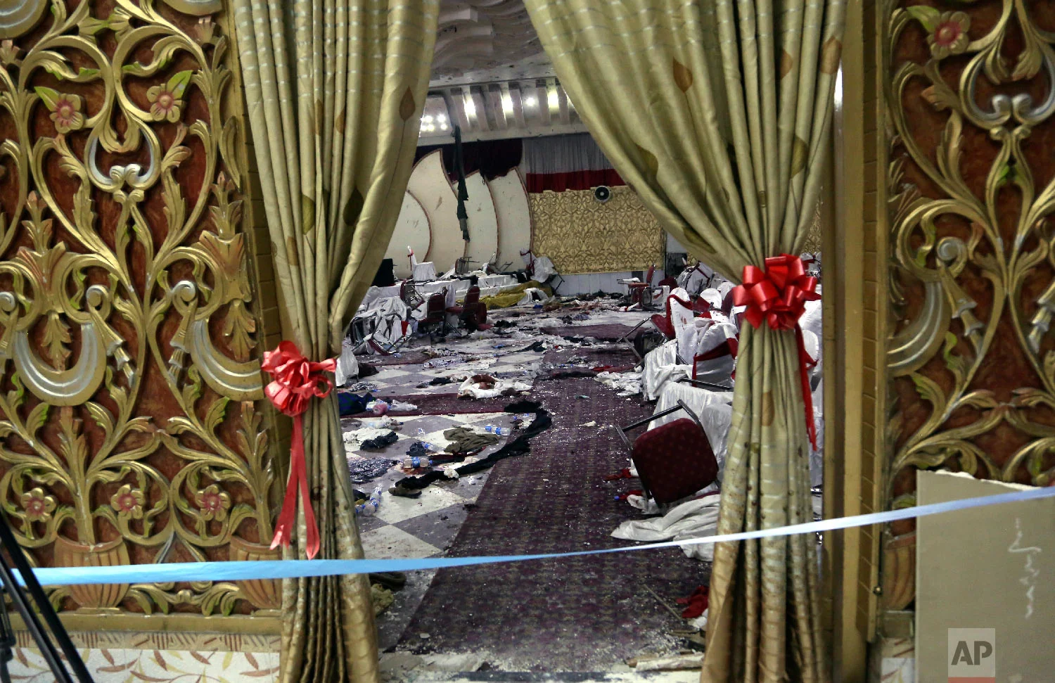 Inside of a wedding hall in Kabul, Afghanistan, is seen, Nov. 21, 2018, a day after a suicide attack. A suicide bomber was able to sneak into the wedding hall where hundreds of Muslim religious scholars and clerics had gathered to mark the birthday of the Prophet Muhammad. (AP Photo/Rahmat Gul)