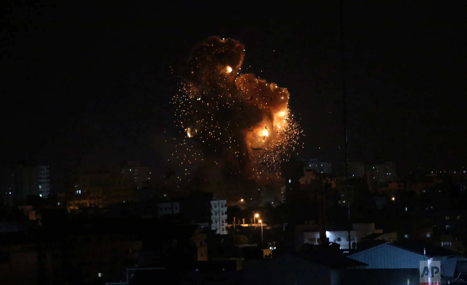 An explosion caused by Israeli airstrikes on the building of Hamas' Al-Aqsa TV station in Gaza City, Nov. 12, 2018.(AP Photo/Adel Hana)