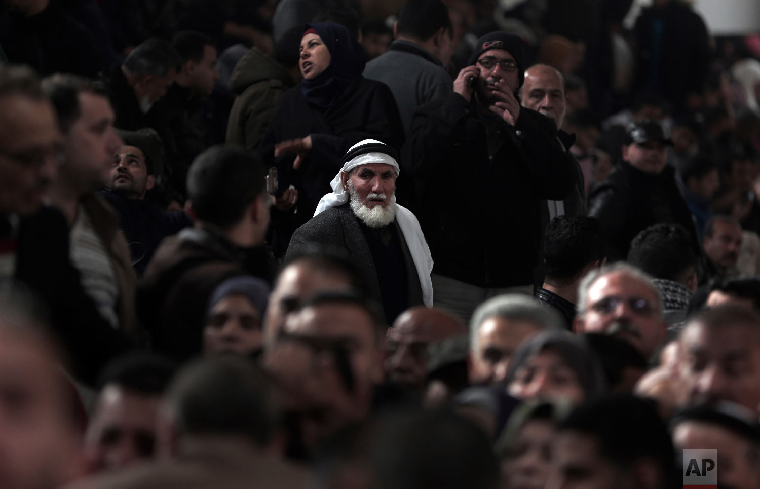 Palestinians wait for their turn to enter the Rafah border crossing with Egypt, in the southern Gaza Strip, Feb, 8, 2018. (AP Photo/ Khalil Hamra)