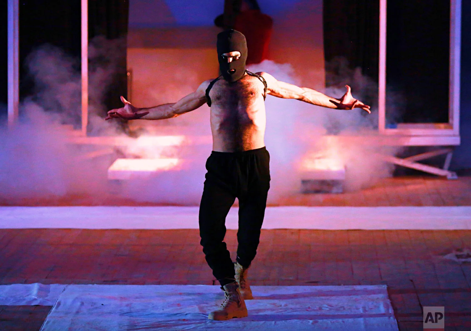 An Iraqi actor performs during a play titled "The strongest" in Baghdad National Theater, Jan 23, 2018. The play is about the negative legacy of the Islamic State group. (AP Photo/Hadi Mizban)