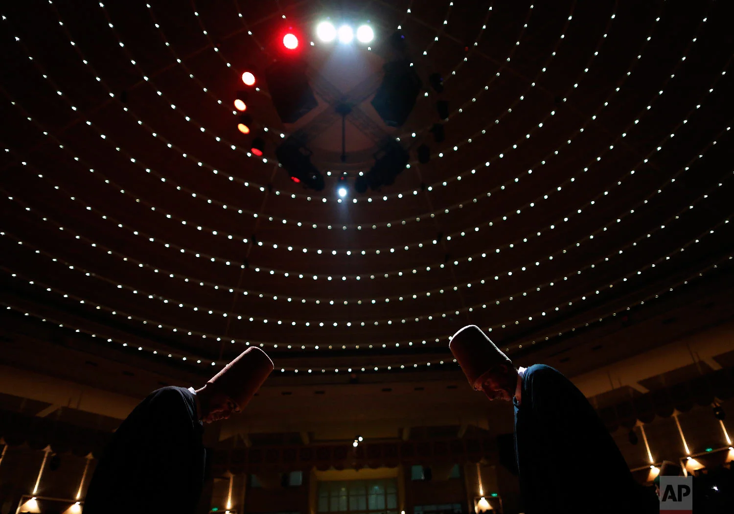 Whirling dervishes of the Mevlevi order bow during a Sheb-i Arus ceremony in Konya, central Turkey, Sunday, Dec. 16, 2018. (AP Photo/Lefteris Pitarakis)