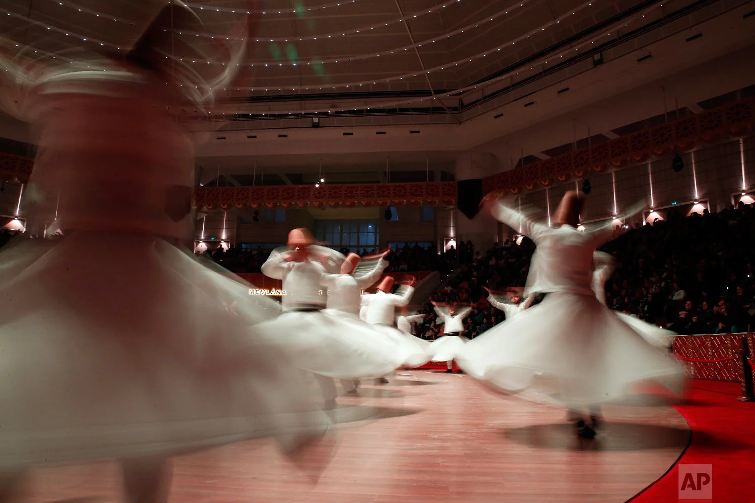 Whirling dervishes of the Mevlevi order perform during a Sheb-i Arus ceremony in Konya, central Turkey, Sunday, Dec. 16, 2018. (AP Photo/Lefteris Pitarakis)
