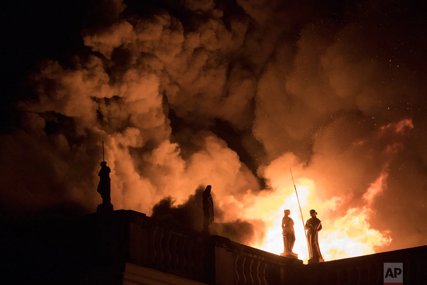 In this Sept. 2, 2018 photo, flames engulf the 200-year-old National Museum of Brazil in Rio de Janeiro, Brazil. The blaze gutted one of the world's oldest museums, destroying much of the 20 million piece collection. (AP Photo/Leo Correa)