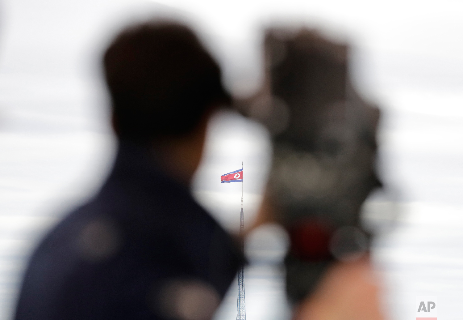  A North Korean flag flutters in the wind atop a 160-meter tower in North Korea's village Gijungdong as seen from the Taesungdong freedom village inside the demilitarized zone in Paju, South Korea, on April 24, 2018. (AP Photo/Lee Jin-man) 