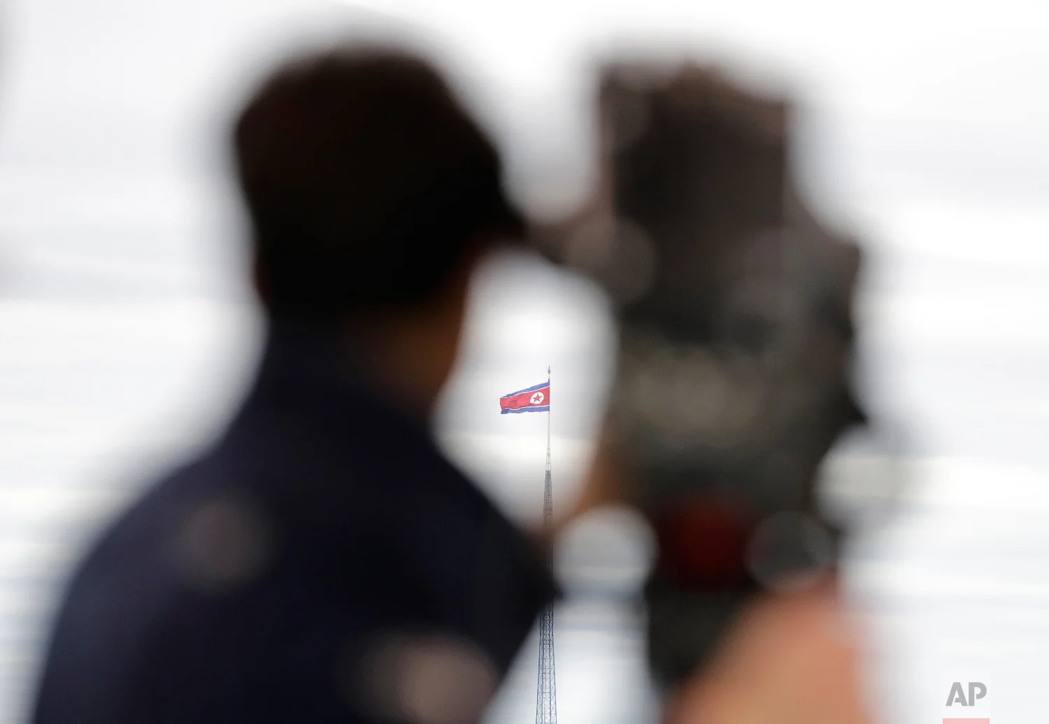 A North Korean flag flutters in the wind atop a 160-meter tower in North Korea's village Gijungdong as seen from the Taesungdong freedom village inside the demilitarized zone in Paju, South Korea, on April 24, 2018. (AP Photo/Lee Jin-man)