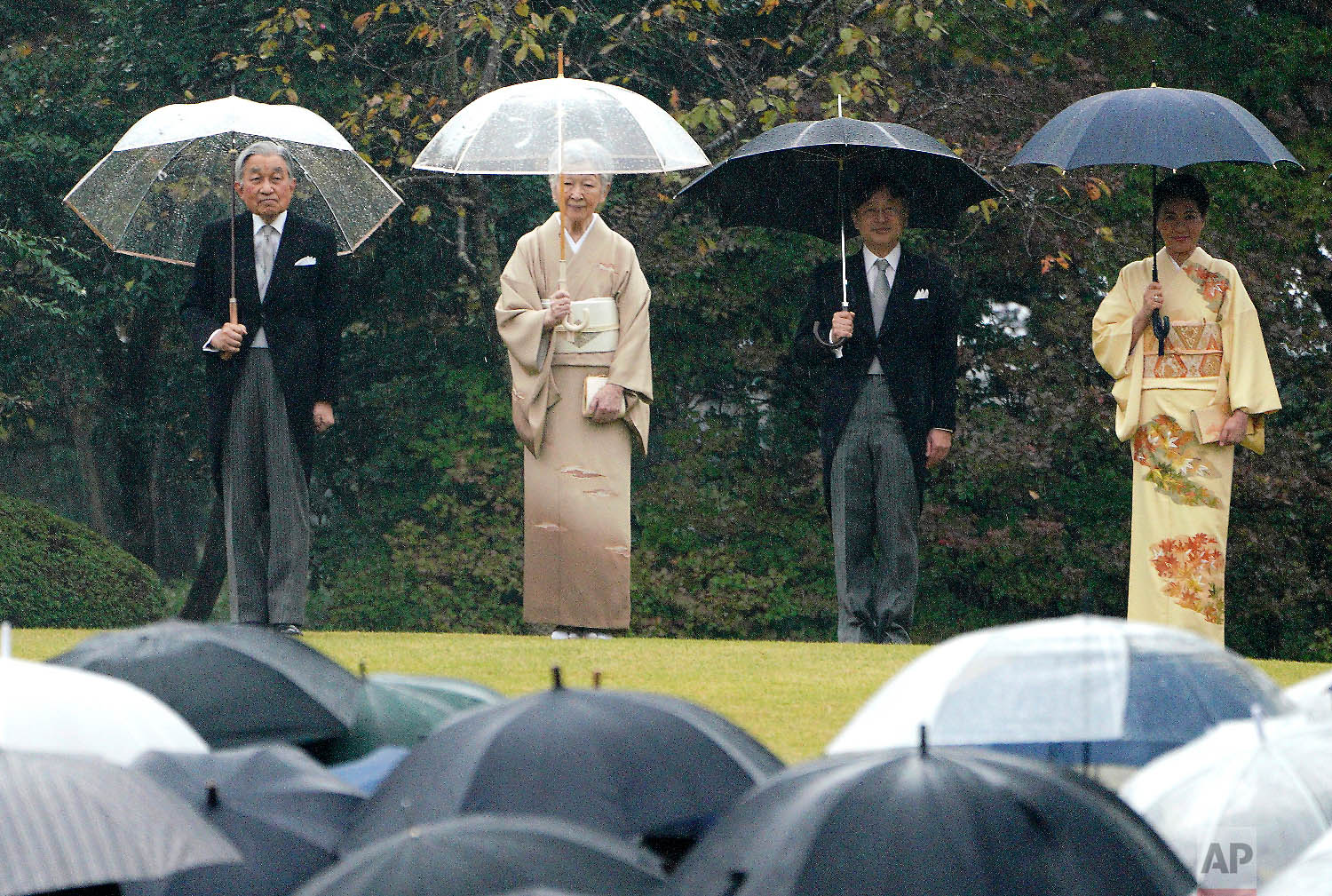  From left to right, Japan's Emperor Akihito, Empress Michiko, Crown Prince Naruhito, and Crown Princess Masako greet guests during an autumn garden party at the Akasaka Palace imperial garden in Tokyo on Nov. 9, 2018. (AP Photo/Eugene Hoshiko) 